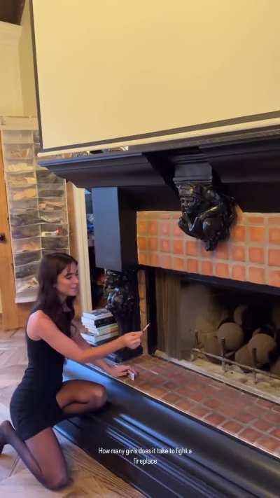 Renee lighting a fireplace