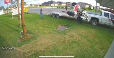 Driving an ATV onto a trailer