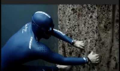 One of the eeriest scenes from the free diving short film One Breath Around The World. He’s running along a drop off in the ocean with just darkness below.