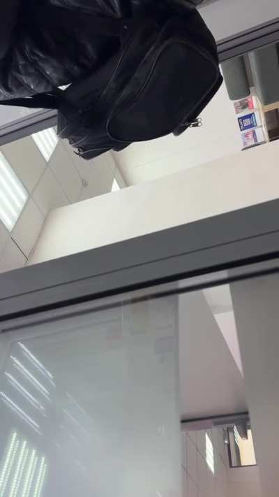 Bank clerks use delay tactics against a robber. 