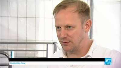 Chinese tourist tries to report a stolen wallet. Ends up in a refugee camp for 12 days.