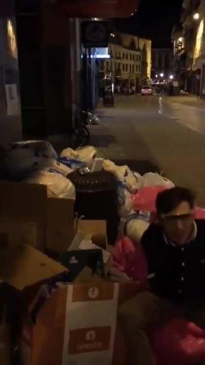 Jumping onto a pile of  trash. 