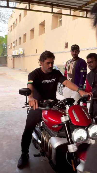 MS Dhoni giving autograph to a fan on his Triumph Rocket 3R, would you get Dhoni's autograph on your bike?