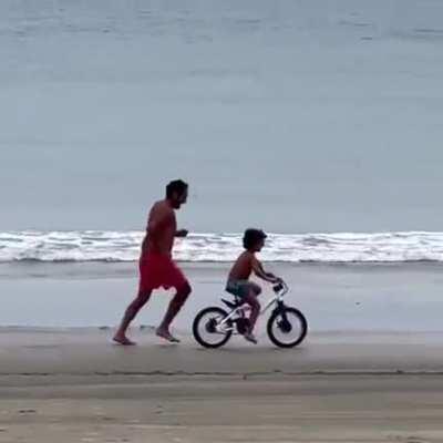 Father ecstatic while teaching son to ride a bike 🚲