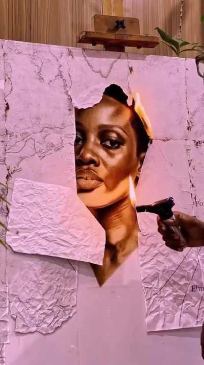 A painting done with literal fire on a canvas by  alexpeter_idoko