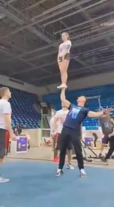 Lifting a woman using one hand