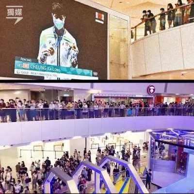 Large crowd in Hong Kong mall boos the anthem of Chinese occupiers during the medal ceremony of HK's first gold