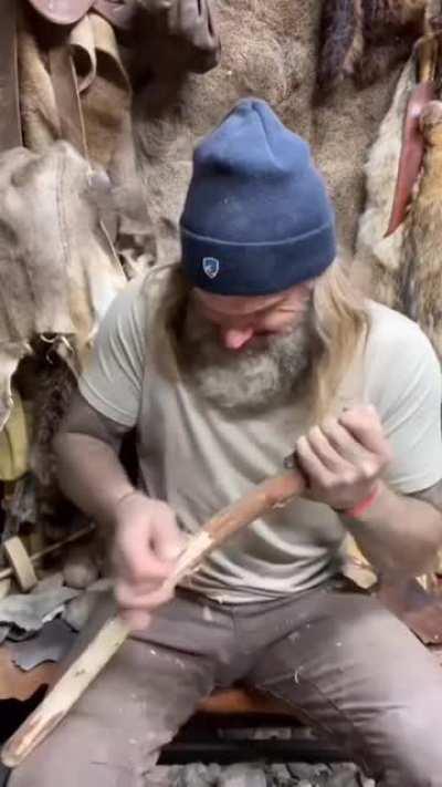 Hand crafting a Palaeolithic stone battle axe.