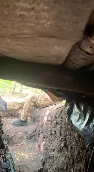 ua pov - artillery shell lands near a ukrainian soldier in a trench