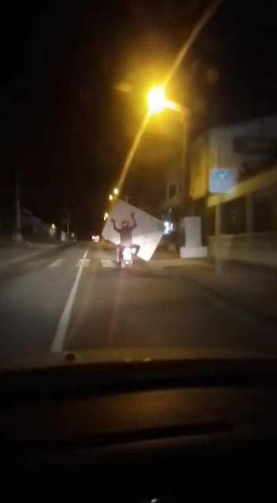 Idiot ridding a scooter.