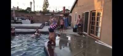 Attempting to do a cool jump over my friend into a pool near a hard surface? Seems like a cool idea!