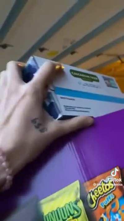 woman films and laughs as friend struggles.