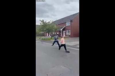 Machete duel in the street