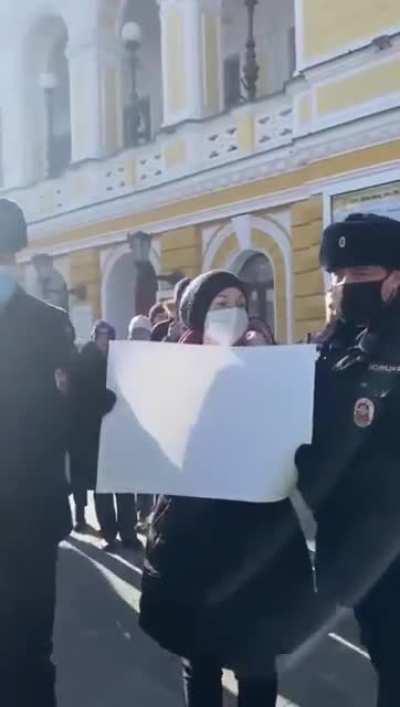 Protests grow in Russia where they are being arrested for holding blank paper signs