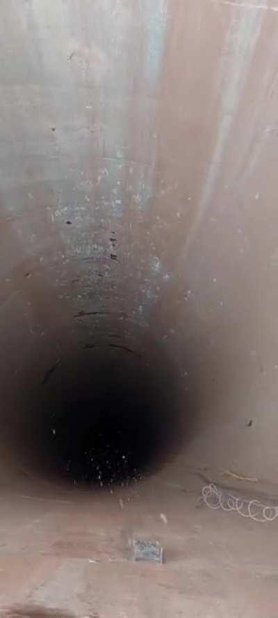 This hole (wait for the sound when it hits the ground)