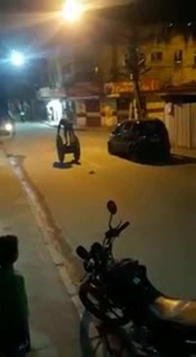 dude casually strolling on a giant reel with a grenade on his pocket