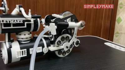 Steampunk inspired 3d printed steam engine bike with single acting air engine. Hand operated balloon pump is source of fuel