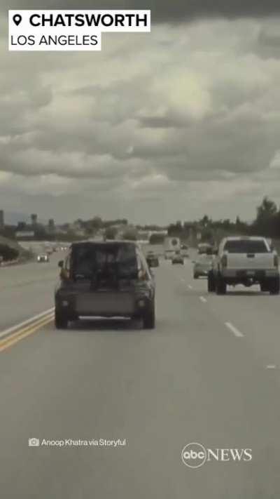 Car flies into the air after hitting a tire on the highway