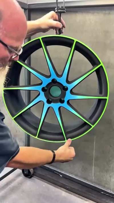 Vacuuming top-coat off a steel rim after powder coating