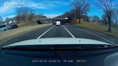 Driving a car carrier under a low bridge