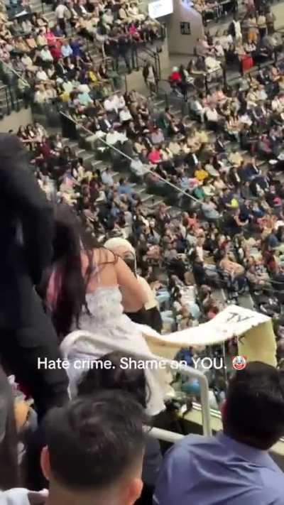 People holding pro Palestine banners at John Jay College graduation ceremony got attacked by two people