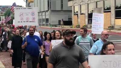 Anti-mask protesters march around the Indiana State House chanting “USA” & “We Will Not Comply.”