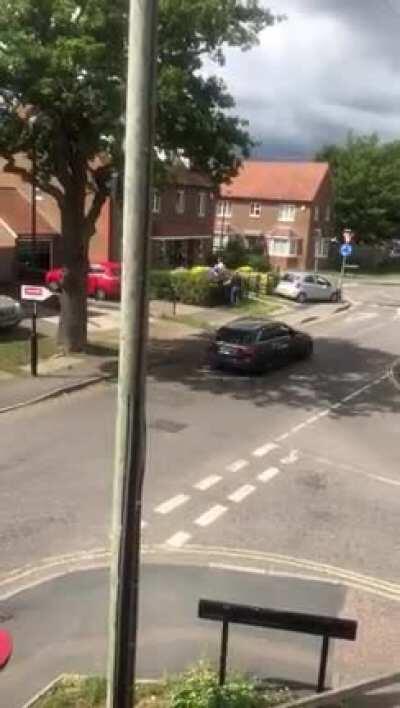 A guy mows down another guy in his car after an argument in the street