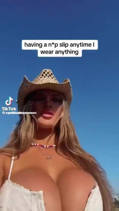 Turns around to do glutes flexing to the beat of the music