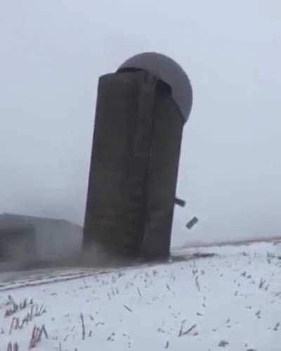 Silo gracefully falls to the ground during demolition