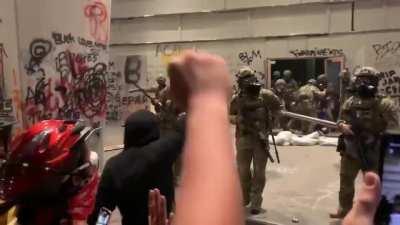 Feds clearing the barricade from in front of the doors to the Portland courthouse