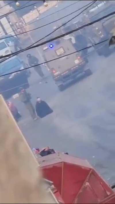 Israeli soldiers use a Palestinian as human shield