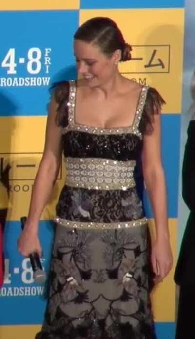 Brie wearing her hair in two buns, laughing, being super adorable