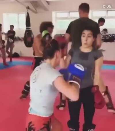 WCGW training MMA in a packed gym