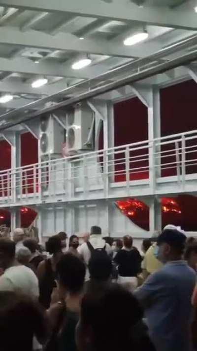 People escaping by ferry POV from the wildfires in Greece, 6 Aug 2021.