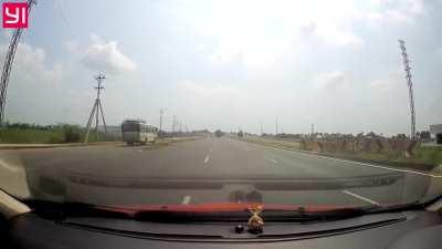 Was he trying to hit the car with a stick?