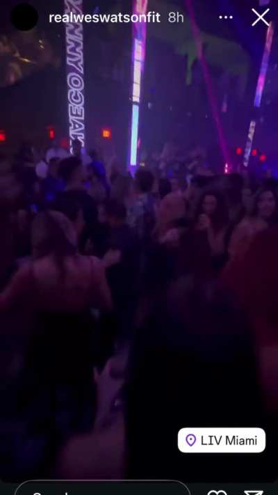 Cringy ass grab + weird dog-whistle sign at LIV