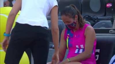 Tennis player Azarenka consoling her opponent after she twisted her ankle and forced to retire