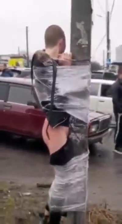 Would be looters in Ukraine are subjected to modern day stockades as they are cling wrapped to utility poles