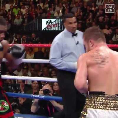 to hit the guy with green gloves