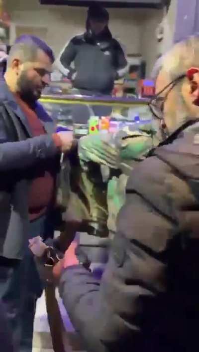 Rebels caught a soldier in Aleppo who had been sleeping all day and had no idea what was going on in the streets, equipped with his weapon and on his way to get some cigarettes from a small shop nearby
