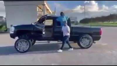 What could go wrong while dancing beside a lifted pickup truck?