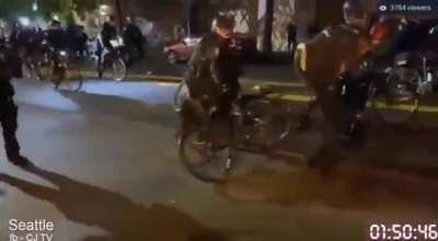 Seattle PD Officer ran over an injured man's head with with his bike.