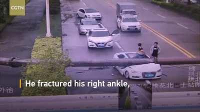 Driver survives and escapes after his car was smashed by a crane