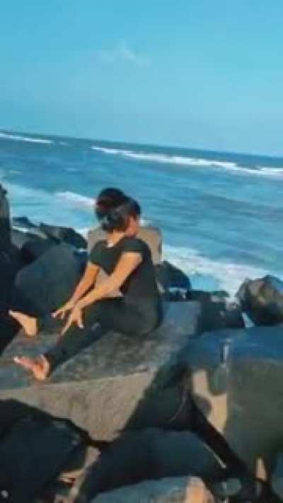 Yoga expert girl turns her upper body 180°