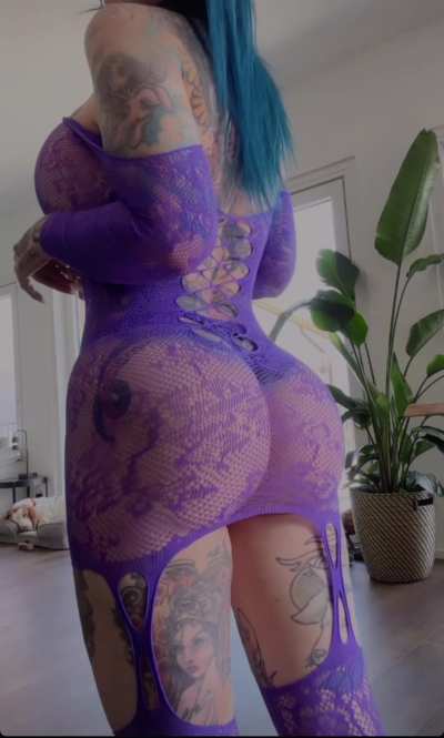 Showing her outfit from the back