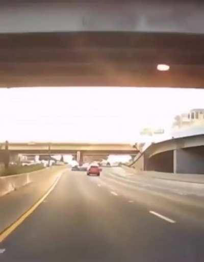 Car looses control and careens off of overpass