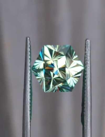 Sorry if not allowed, I thought this might be appreciated here. I cut a gem by request to look like a D20, but also be practical to set in a ring.