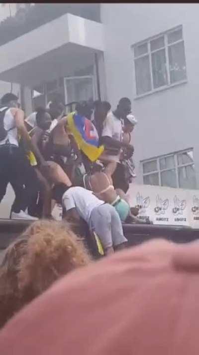 WCGW dancing on top of a bus stop