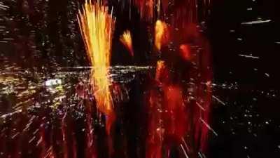 A drone flying through fireworks