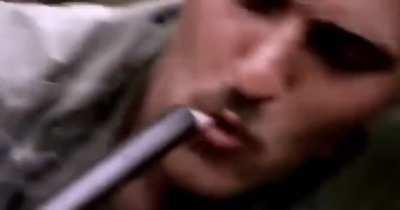 American soldiers in Vietnam smoking Marijuana out of the barrel of a Shotgun, 1970.